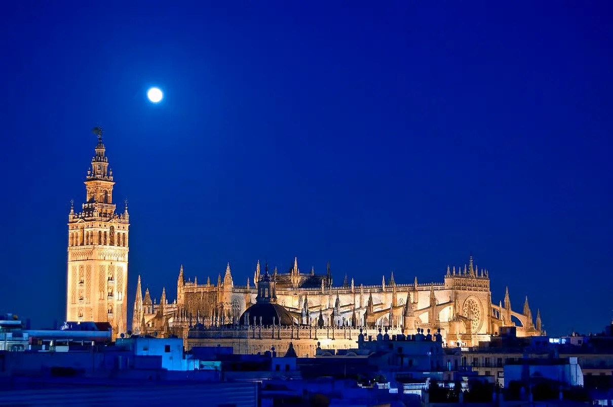 Seville Cathedral interior night tour with illuminated nave and light show